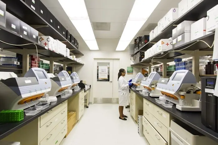 Clinical laboratory bench with diagnostic equipment.