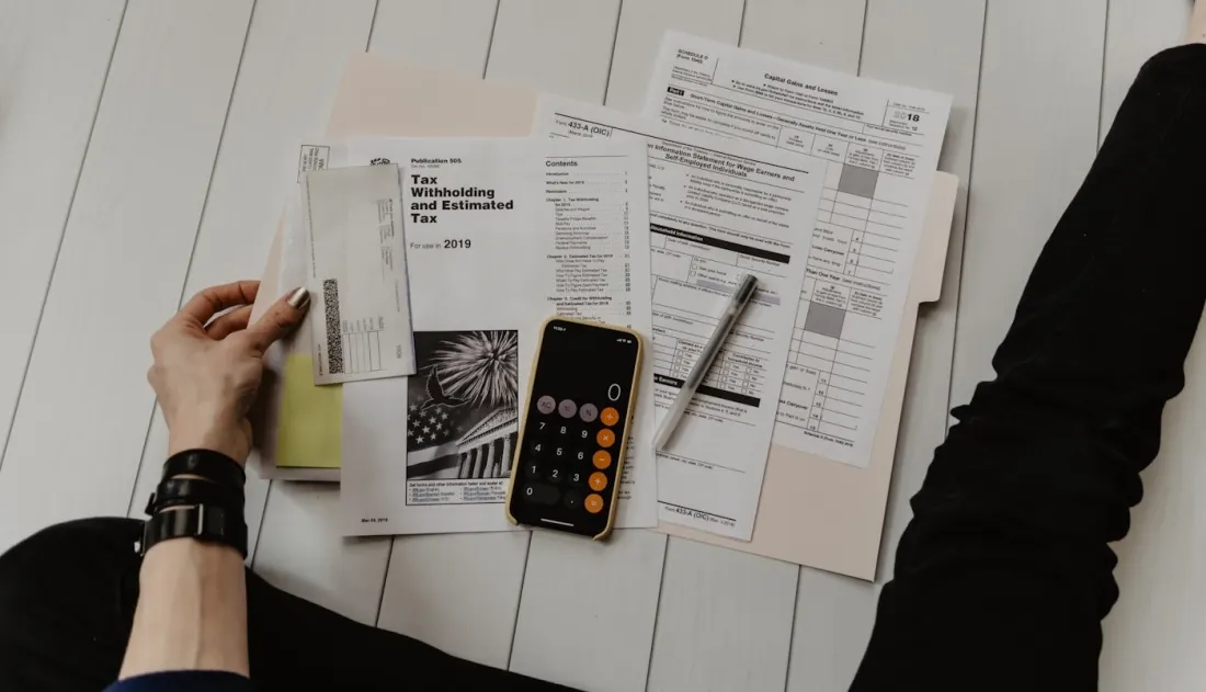 Calculator and paperwork used for comparing provider pricing.
